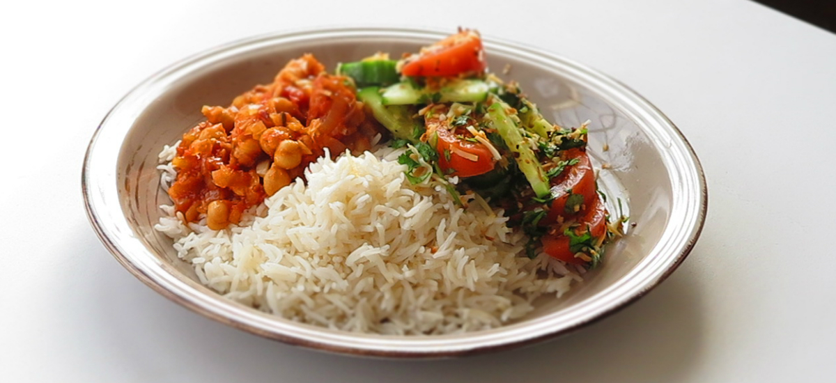 Chana masala with basmati rice, cucumber, tomato and toasted coconut