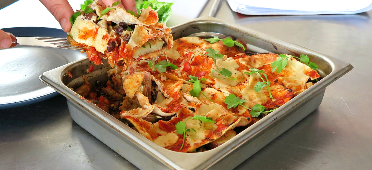 Tortilla casserole with black beans, mushrooms and coriander