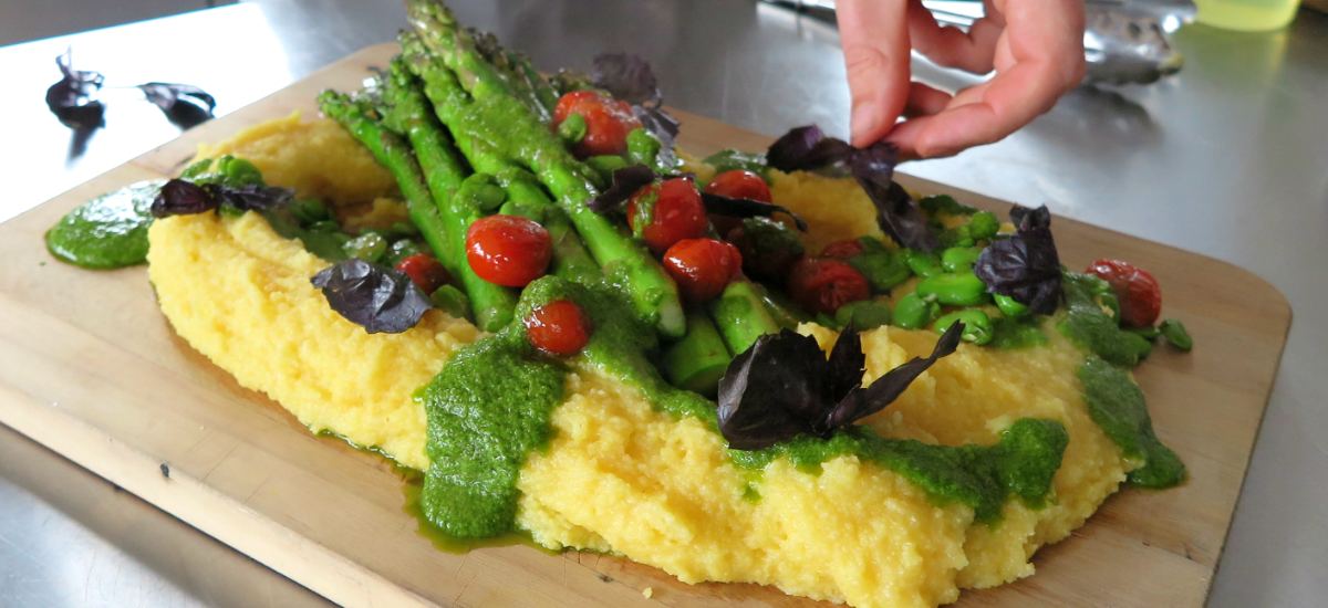 Creamy polenta with summer vegetables and salsa verde