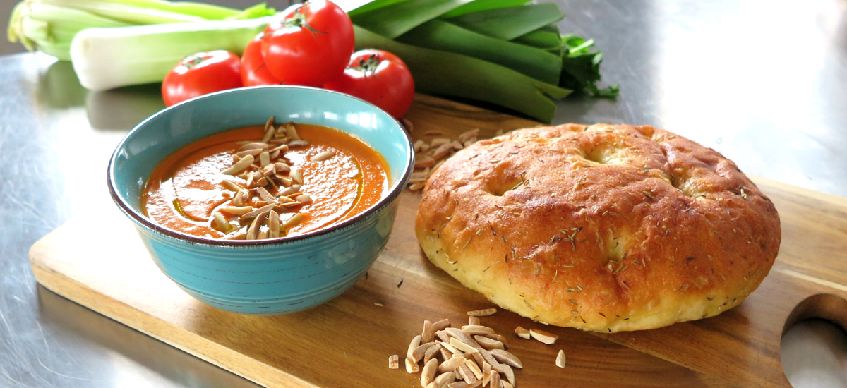 Roast pepper and tomato bisque with almonds and seeded sour dough