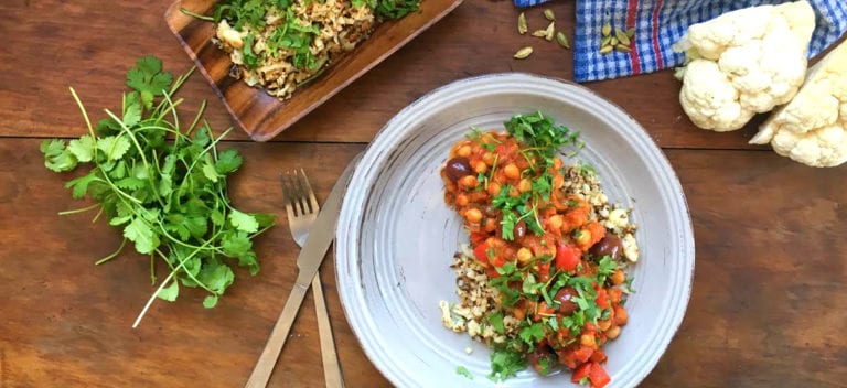 Shakshuka with black olives and cumin rice with roast cauliflower and date salad