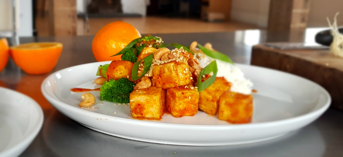 Crispy orange tofu with sticky rice, pak choi, green beans and housemade sweet chili