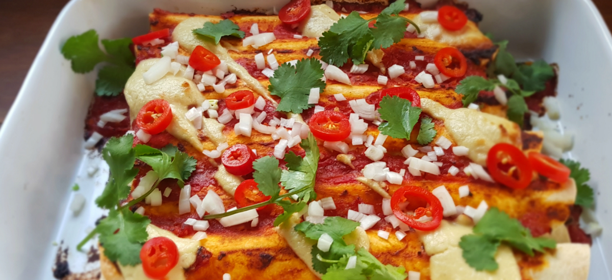 Twin bean enchiladas with sour cream and pickled jalapeños