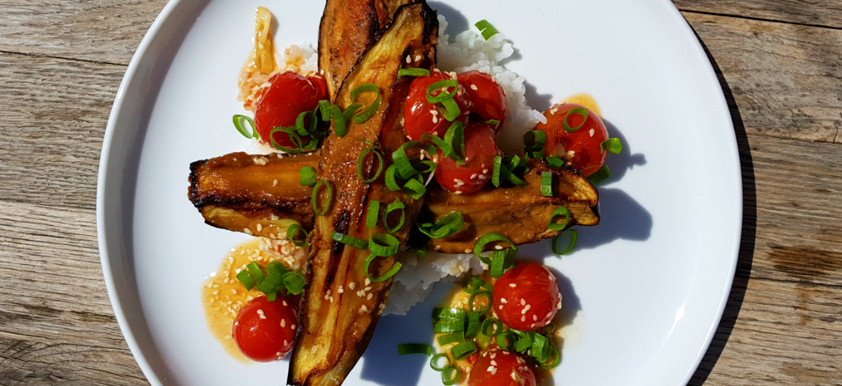 Miso eggplant with sticky rice, blistered cherry tomatoes, sesame and pak choi