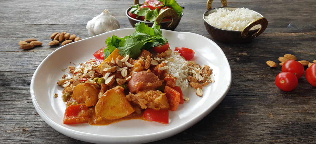 Allo mirchi - potato and capsicum curry with basmati, cherry tomatoes and almonds