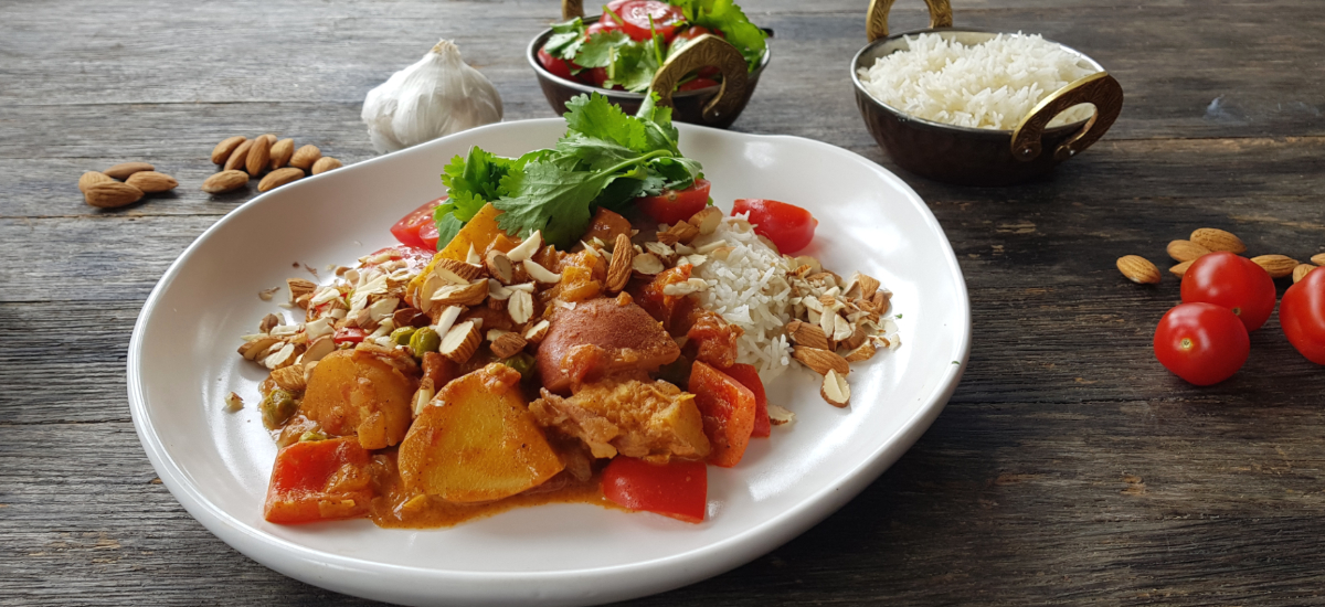 Allo mirchi - potato and capsicum curry with basmati, cherry tomatoes and almonds