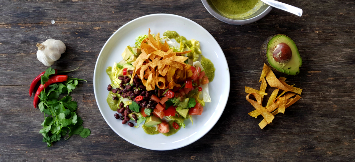 Taco salad garlic roast pepper cumin beans romaine avocado and tomatillo salsa