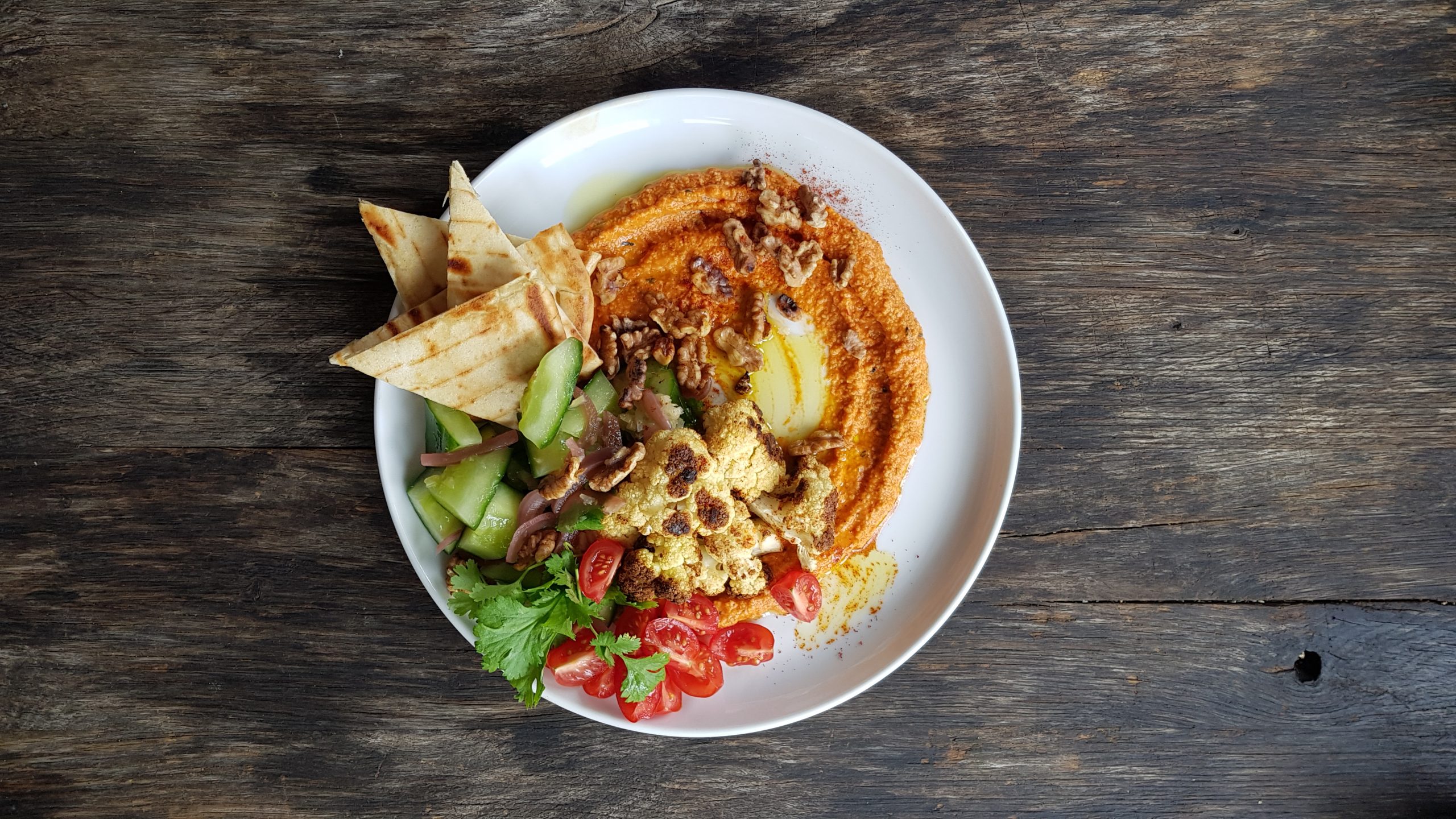 Feta and red pepper dip, roast cauliflower, smashed cucumber, sumac walnuts and pita bread