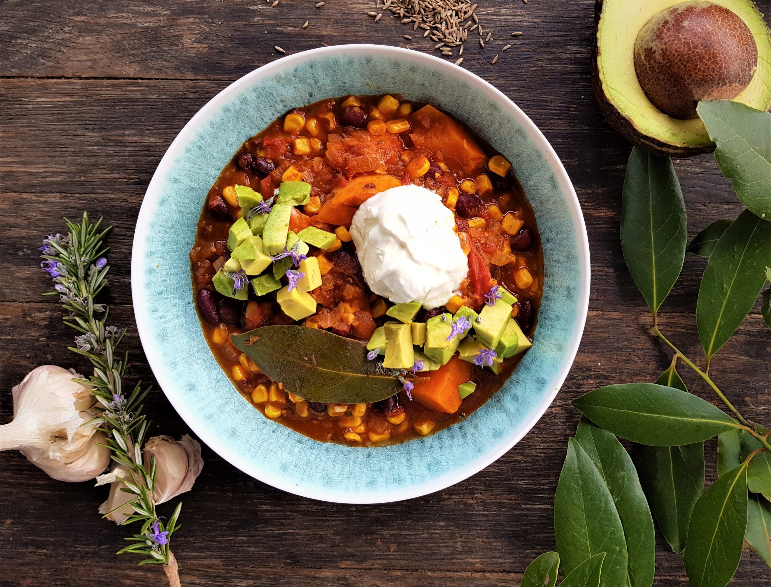 Black bean pozole with corn, kumara, avocado and lime sour cream