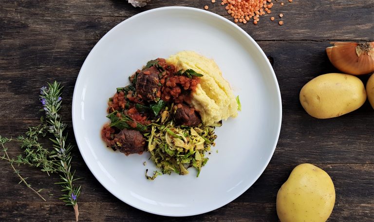Mushroom, split pea and red wine ragu with mashed potato and charred Brussels sprouts