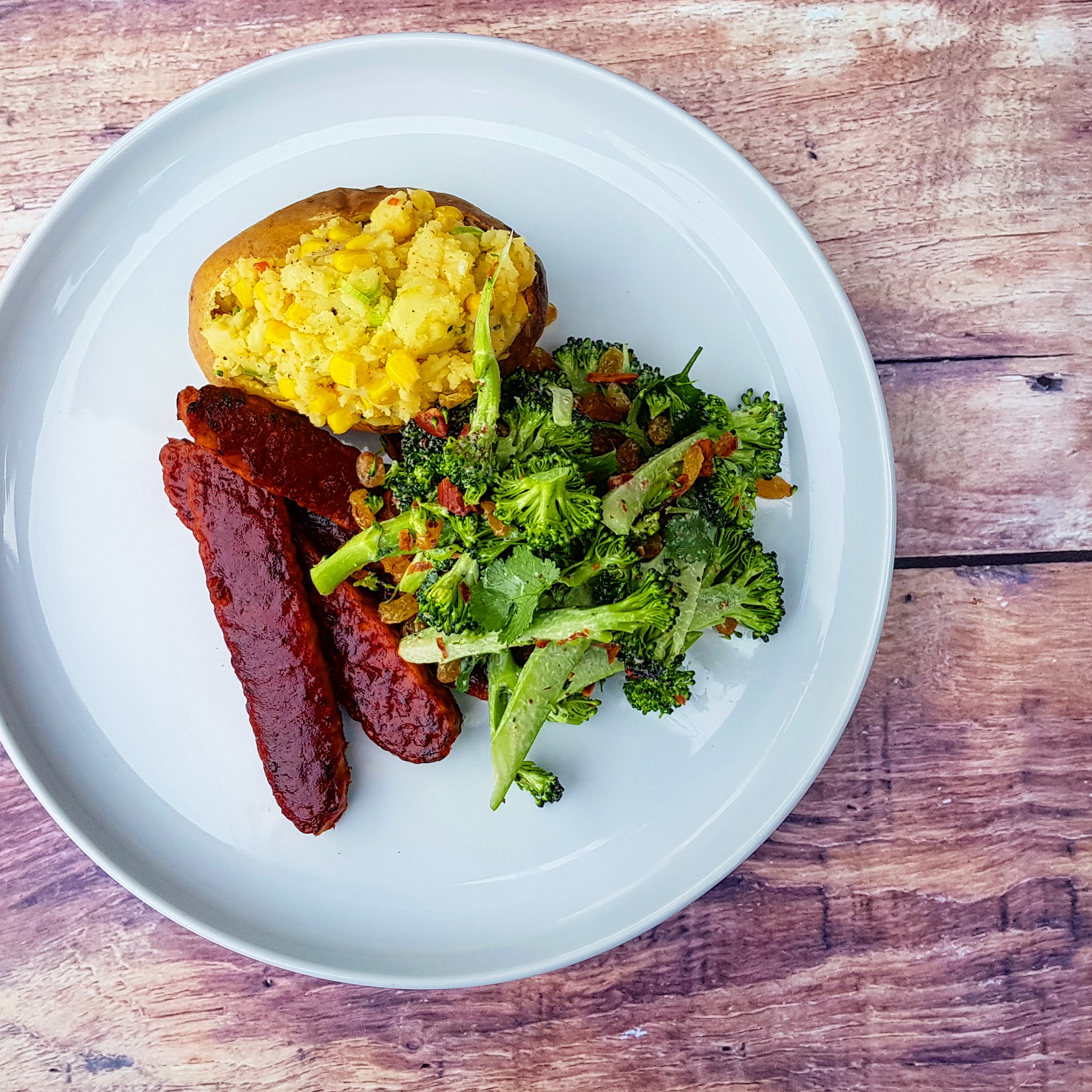 BBQ tempeh 'ribs', lemon thyme and corn stuffed potatoes, broccoli, almond and golden raisin ranch salad