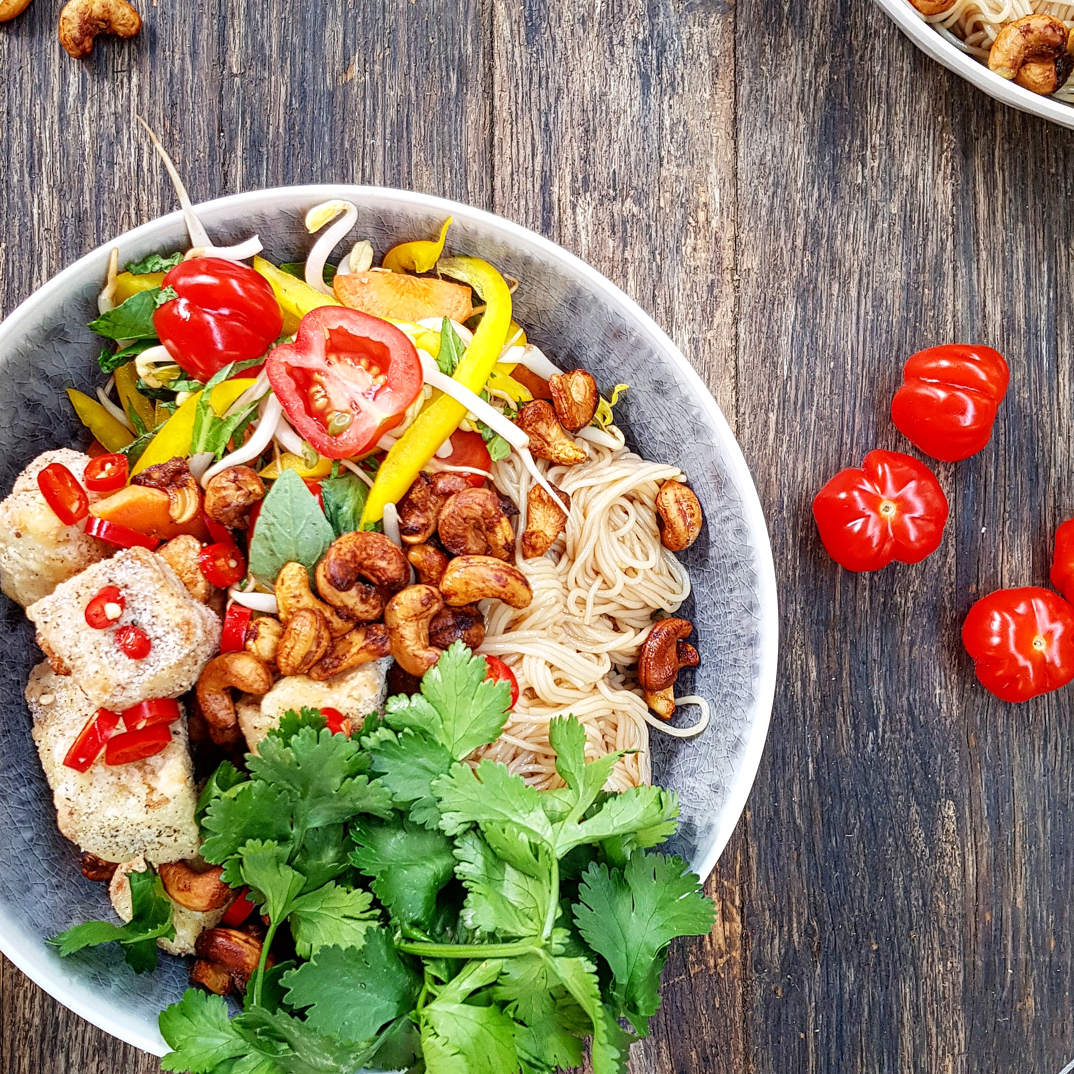 Vermicelli tofu spring salad with curried cashews, spring vegetables, chilli and herbs