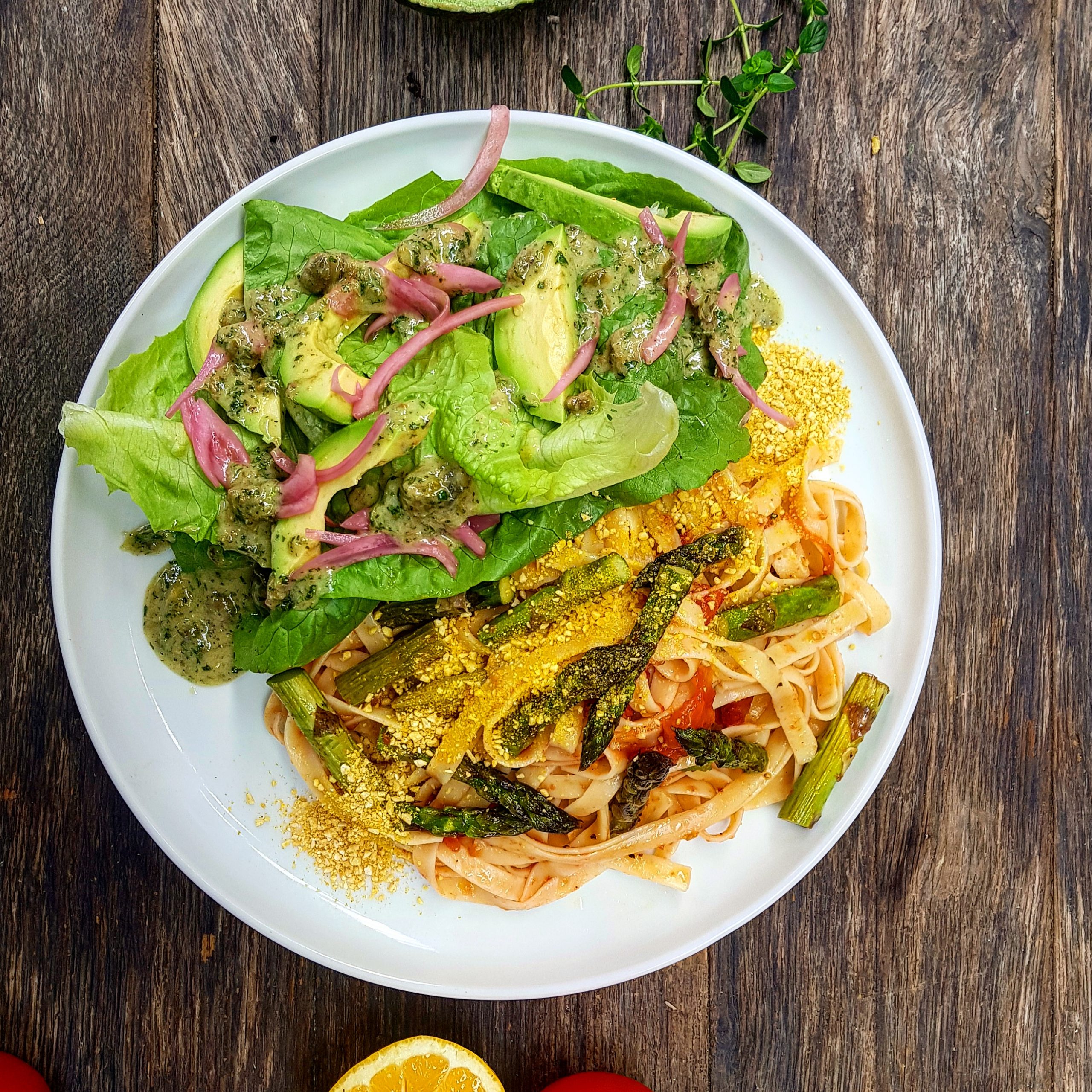 Asparagus and lemony tomato pasta with black pepper parmesan, avocado verde salad