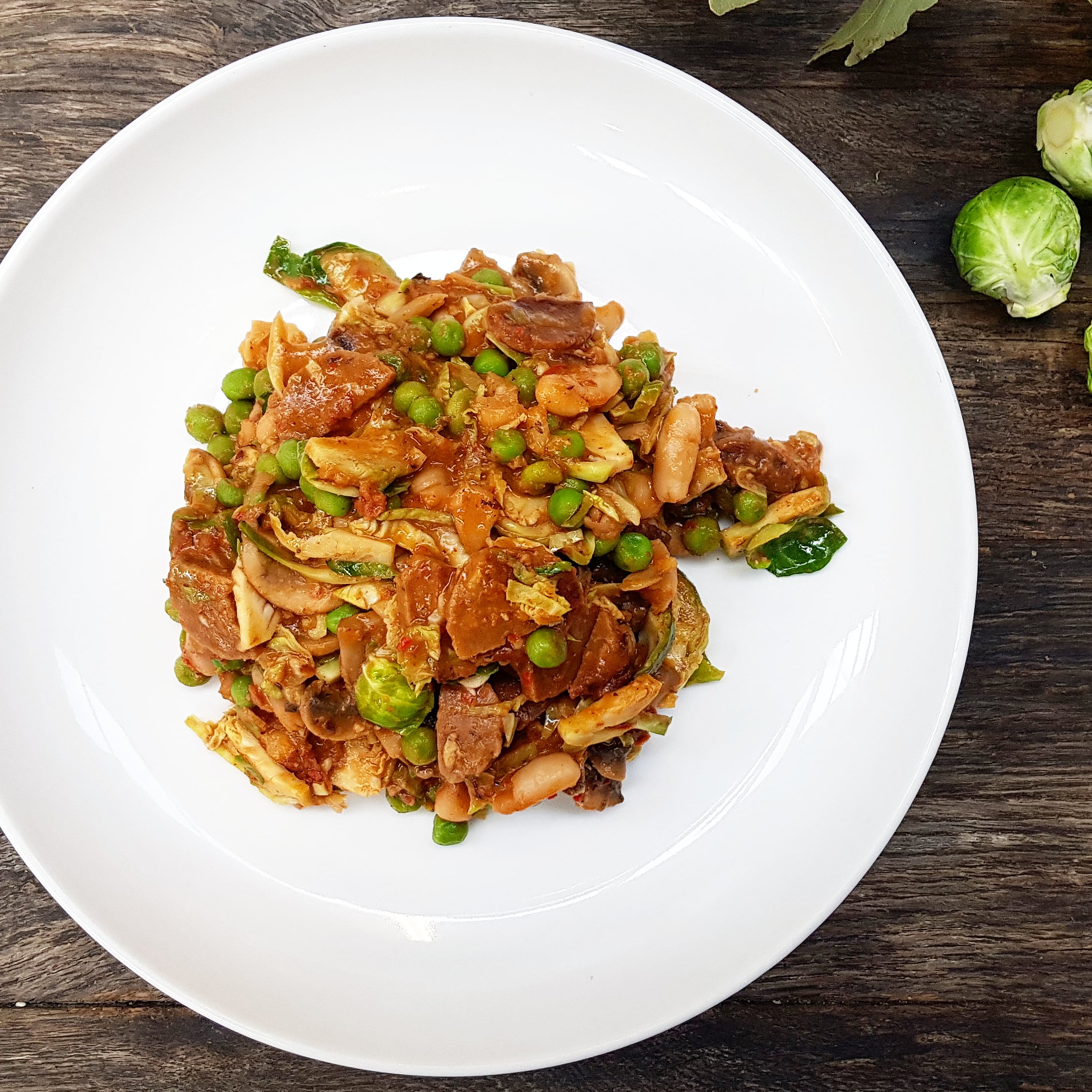 Chorizo and white bean fricassee with mushroom, Brussels sprouts and romesco sauce